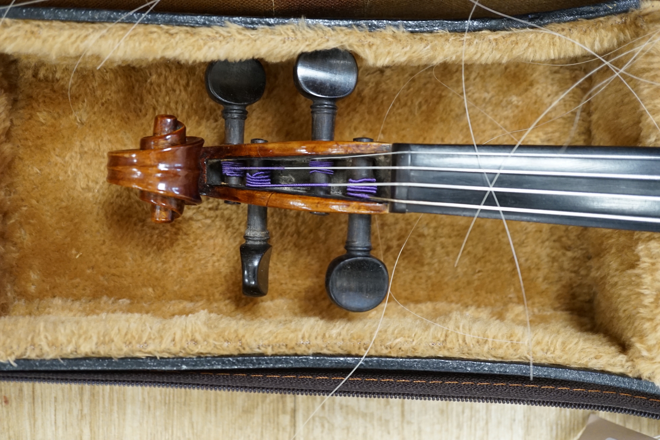 A cased 19th century German violin with paper label for August Hensel, length of body, 36cm, with two bows, CITES submission references, FBHZDSA1 and ZCXXMHV4